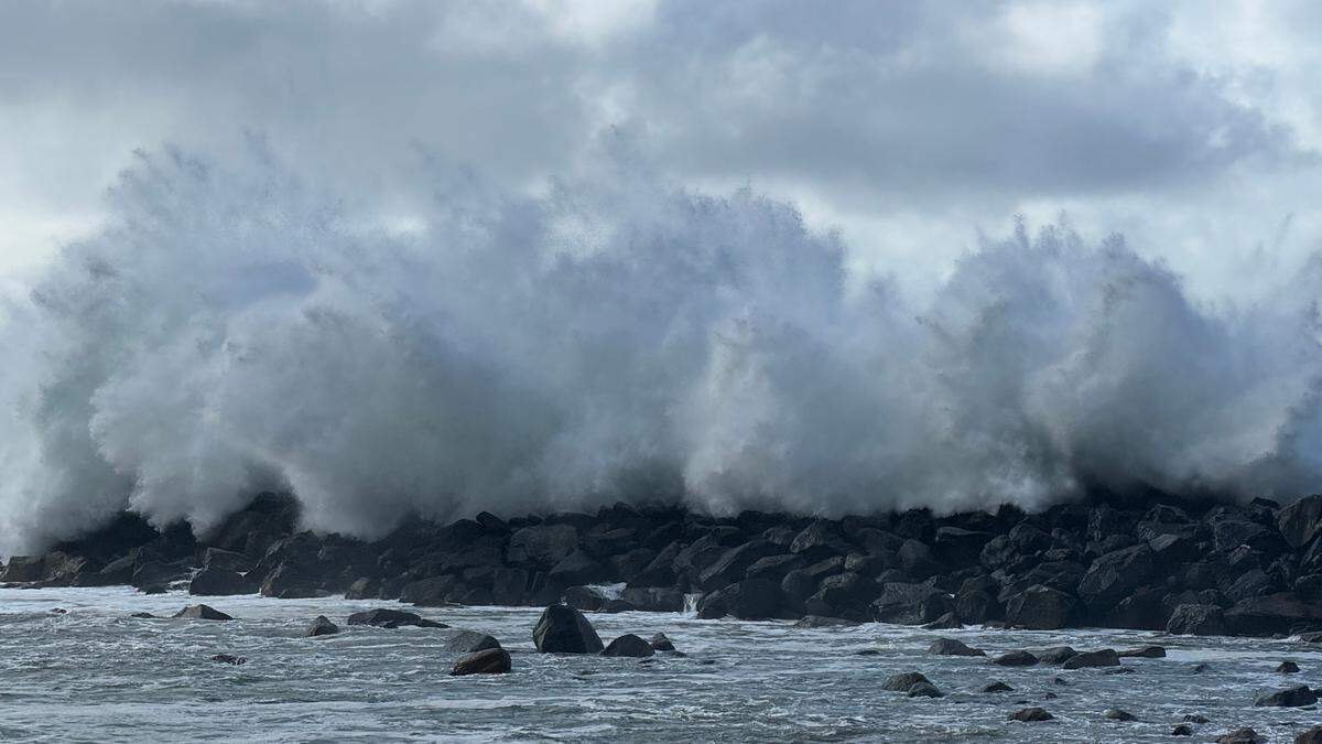 Powerful waves crash over the breakwater in Morro Bay on Saturday, Dec. 30, 2023.