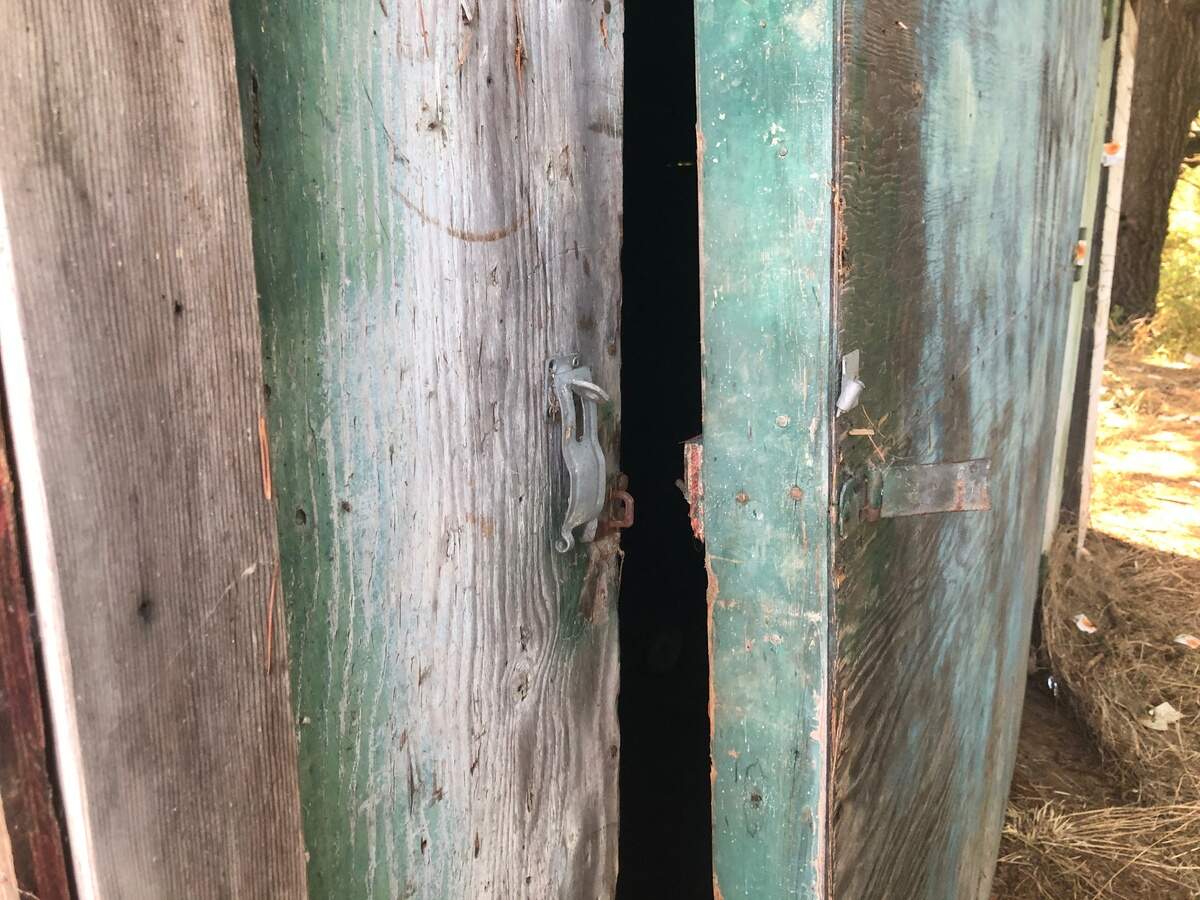 A Wheeler-Smith storage unit shows signs of being broken into.