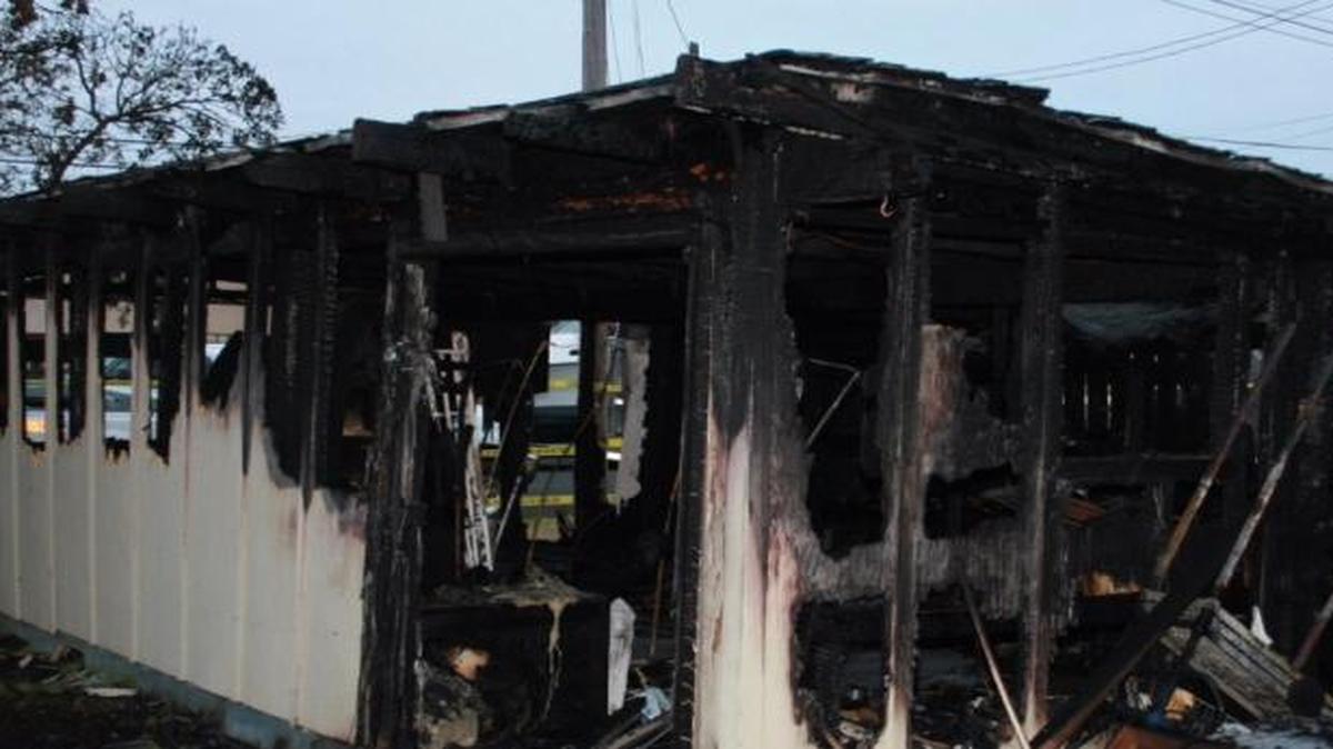 Authorities say an early-morning blaze that destroyed a Morro Bay garage and damaged two homes Monday was caused by overloaded electrical wiring to an indoor cannabis grow.