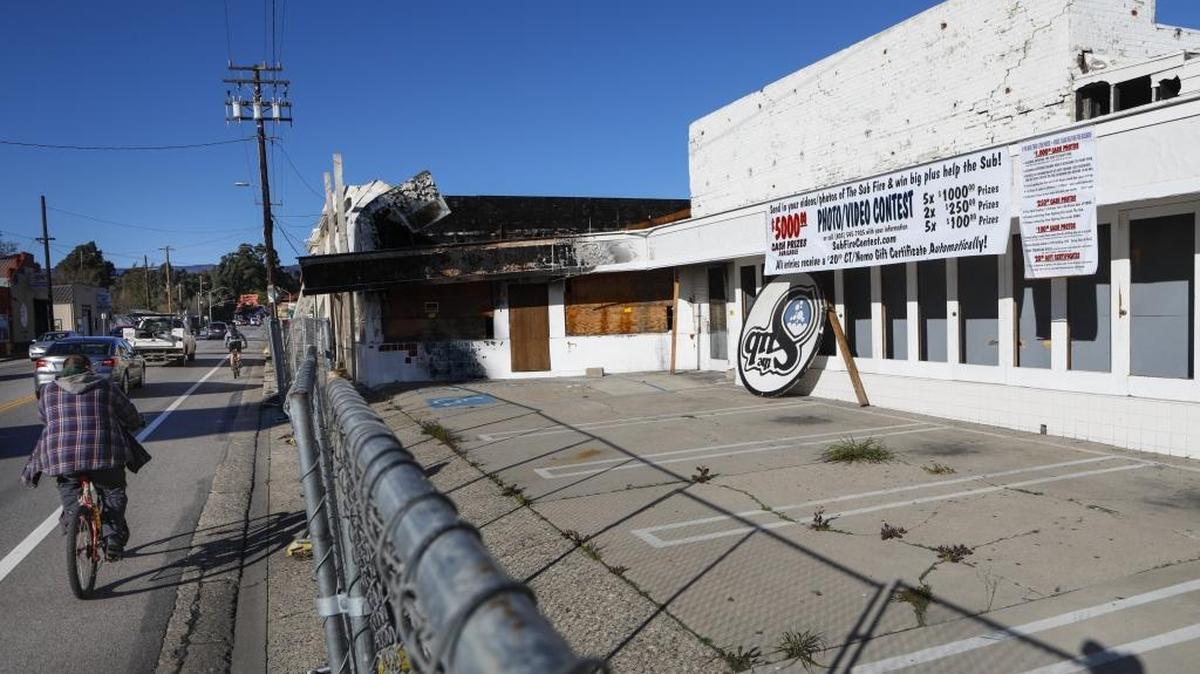 Banners have been hung from the former The Sub/Square Deal Records buildings related to the December 2015 fire that destroyed it.