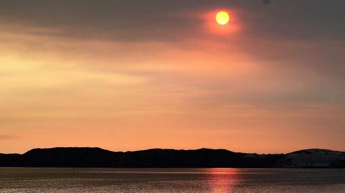 The sun sets over the Morro Bay Estuary.