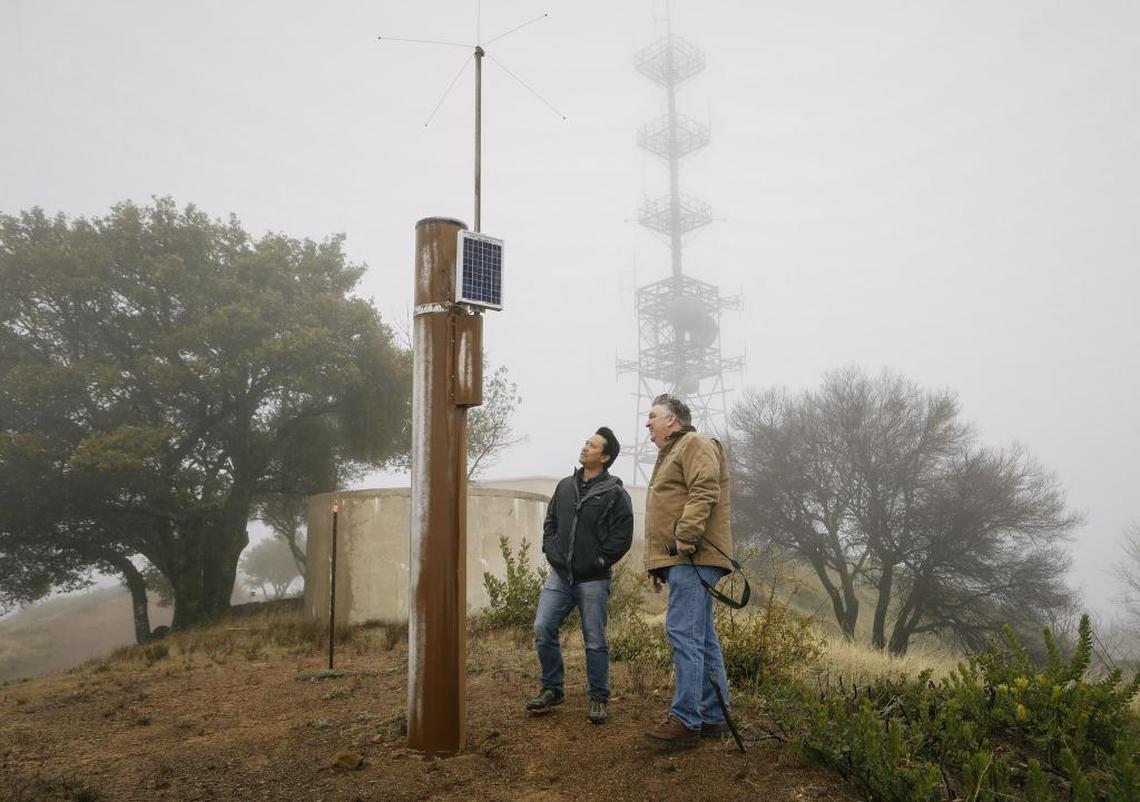 Ray Dienzo from SLO County Public works and Diablo Canyon meteorologist John Lindsey survey the Rocky Butte rain gauge on a recent afternoon.