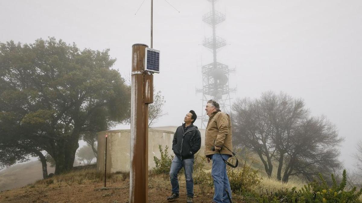 Ray Dienzo from SLO County Public works and Diablo Canyon meteorologist John Lindsey survey the Rocky Butte rain gauge on a recent afternoon.
