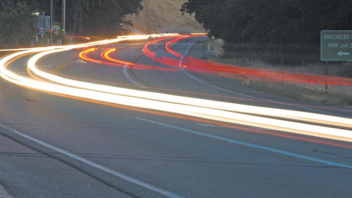 Traffic zooms by at dusk in this 30 second exposure on Highway 41 in Atascadero looking west near the Atascadero Lake Park and Zoo. The city is holding an open house Tuesday, March 8, to discuss plans for Highway 41 improvements.