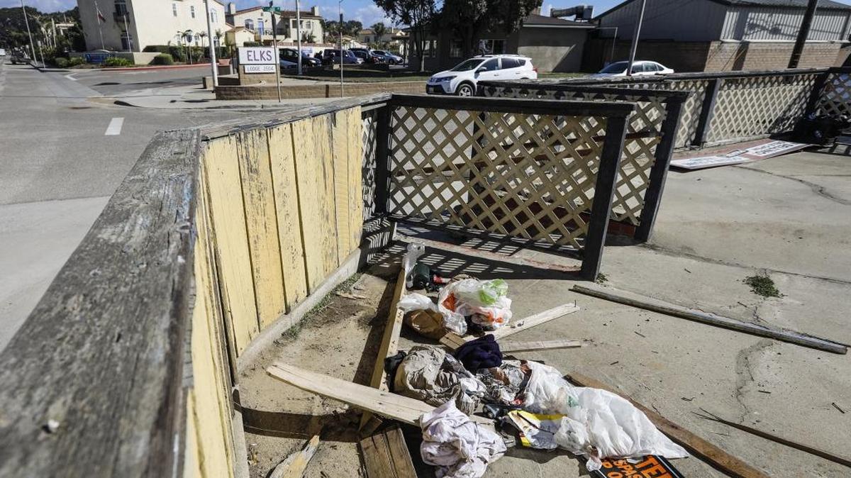 A pile of trash sits on the porch area of the closed Oceano Beach Fish and Chips Restaurant on Pier Avenue. Some residents say the county is neglecting Oceano, with trash heaps, vacant properties and even rat infestations along the town’s main thoroughfare.