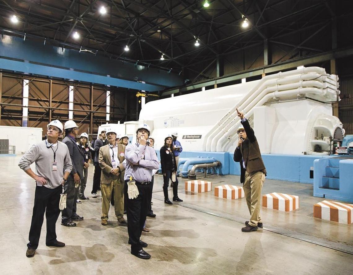 Station director Jim Welch, right, gives members of the California Coastal Commission and others a tour of the generator turbine deck of the Diablo Canyon nuclear power plant in January 2013.