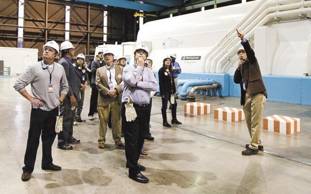 Station director Jim Welch, right, gives members of the California Coastal Commission and others a tour of the generator turbine deck of the Diablo Canyon nuclear power plant in January 2013.