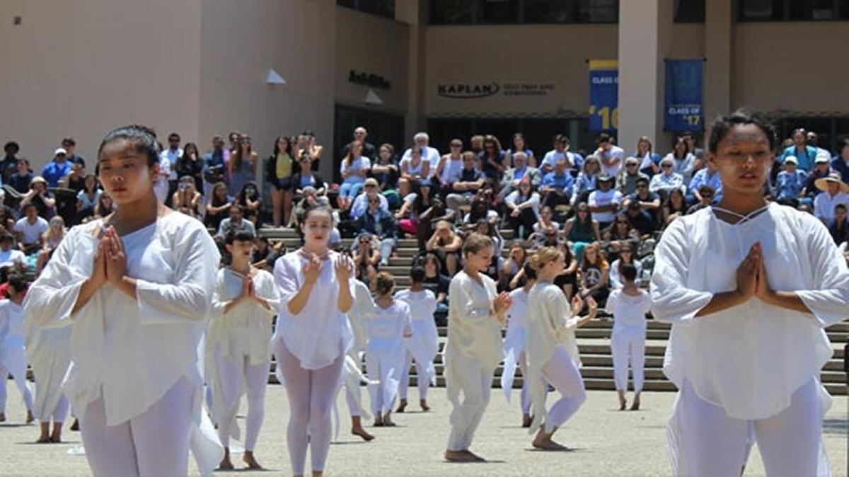 UCSB dance students perform ‘Table of Silence’ on Monday in Storke Plaza to commemorate six university students who died in the Isla Vista massacre two years ago.