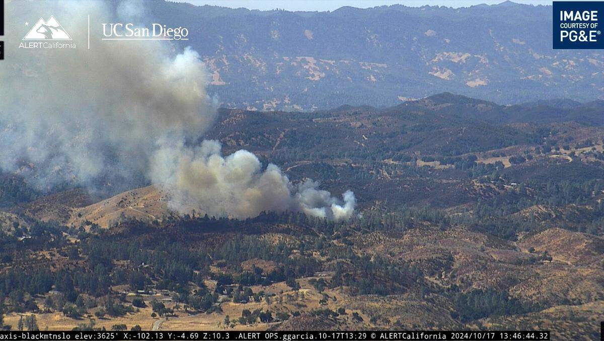 A vegetation fire burns on Huer Huero Road near Parkhill Road east of Santa Margarita on Oct. 17, 2024.