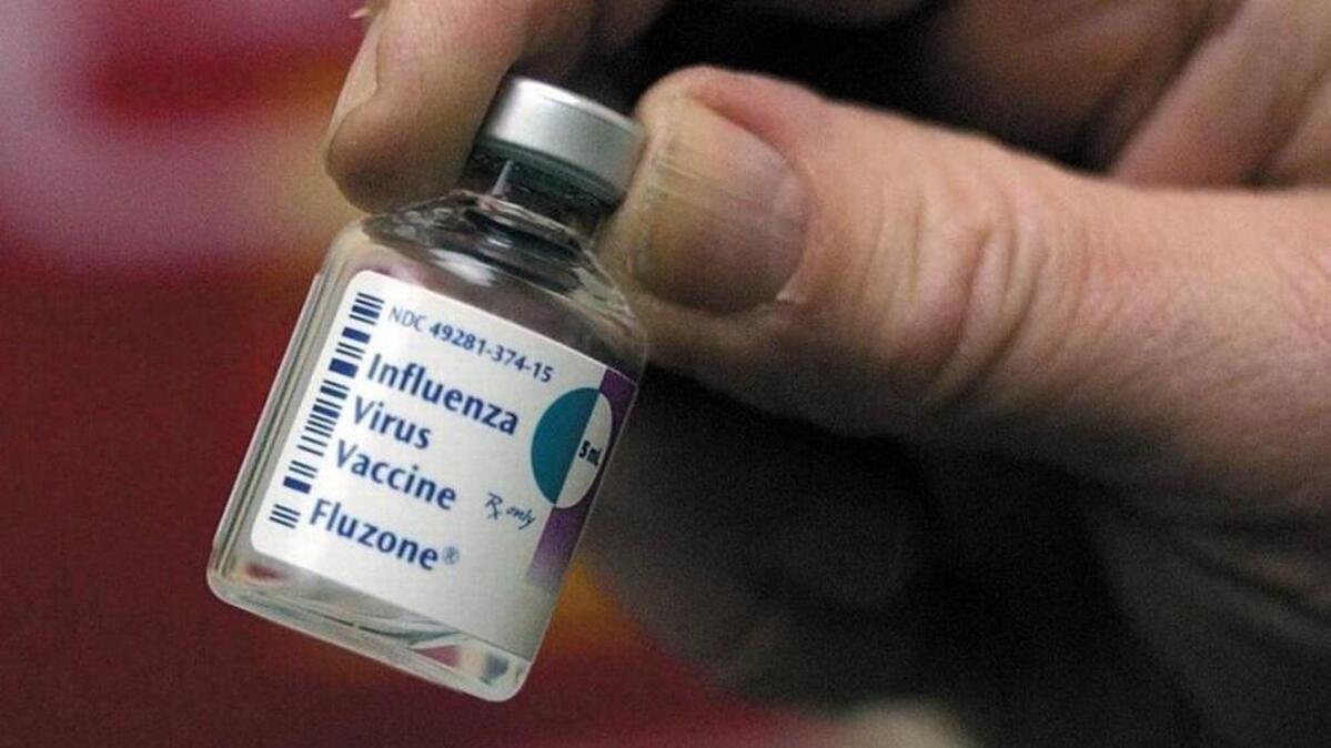 An empty bottle of flu vaccine.