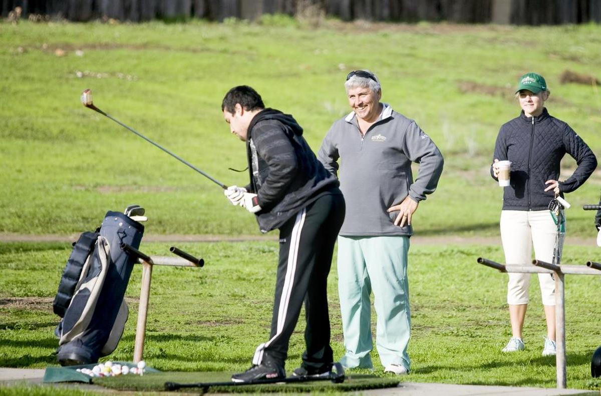 Cal Poly men’s golf program head coach Scott Cartwright and women’s head coach Sofie Aagaard were on hand with the players who buddied with special needs participants to help them have a fun day golfing at the course. Cartwright, center, and Aagaard watch as Special Heroes participant Josh Hoobery, left, 21, of Santa Maria, practices drives. Cartwright is retiring as Cal Poly’s golf coach at the end of the year.