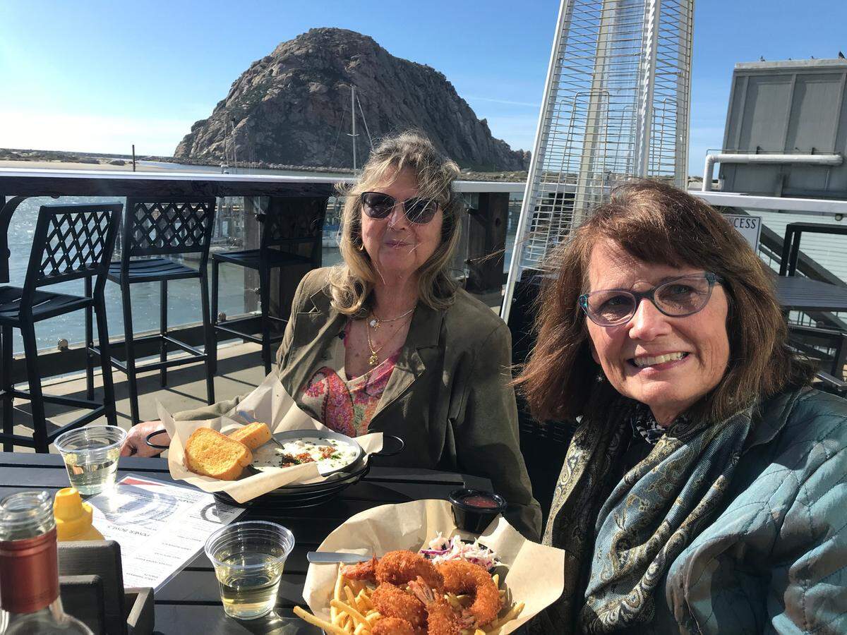 Los Osos residents Diana Bowlby, left, and Nancy Dahl have a pre-birthday lunch for the latter Friday, Feb. 9, 2024, at Morro Grill. Bowlby opted for the Grill’s seafood chowder while Dahl picked the Bay Basket with coconut shrimp.