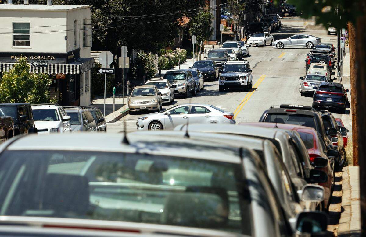 Parked cars line Chorro Street in downtown San Luis Obispo. SLO officials are encouraging drivers to park in downtown garages rather than on the street to avoid potential tickets if meters expire. The garages will soon have automated systems that allow motorists to “pay-on-foot” before leaving.