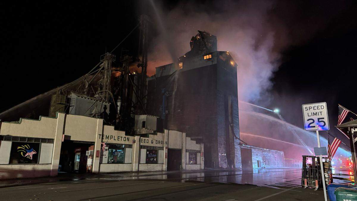 Flames could be seen erupting from an upper floor of Templeton Feed & Grain early July 5, 2025, as firefighters attempted to save the building.&nbsp;