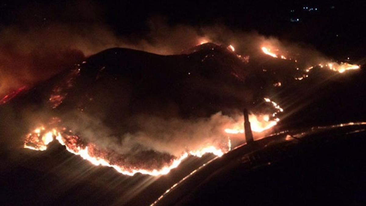 An aerial view shows the brush fire that broke out about 11 p.m. Friday above Highway 101 south of Carpinteria.