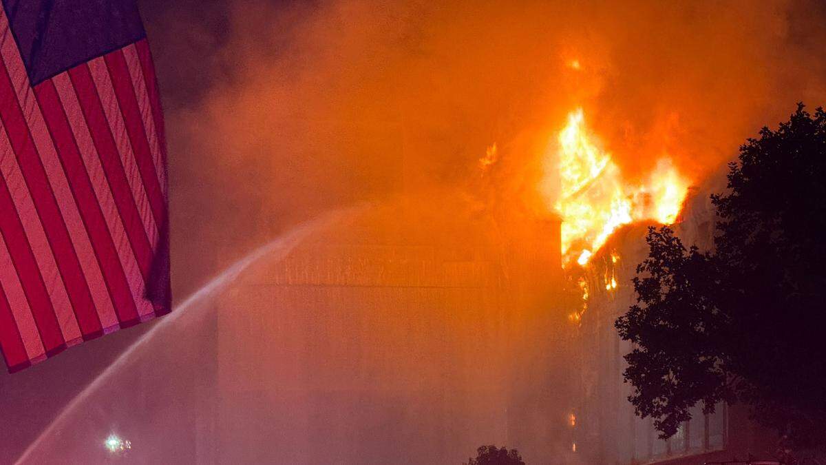 Flames could be seen erupting from the upper floor and roof area of Templeton Feed & Grain early July 5, 2025, as firefighters attempted to save the building.&nbsp;