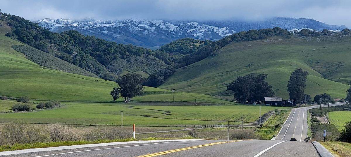 Snow dusts the hills north of Highway 46 West on Thursday morning, Feb. 23, 2023.