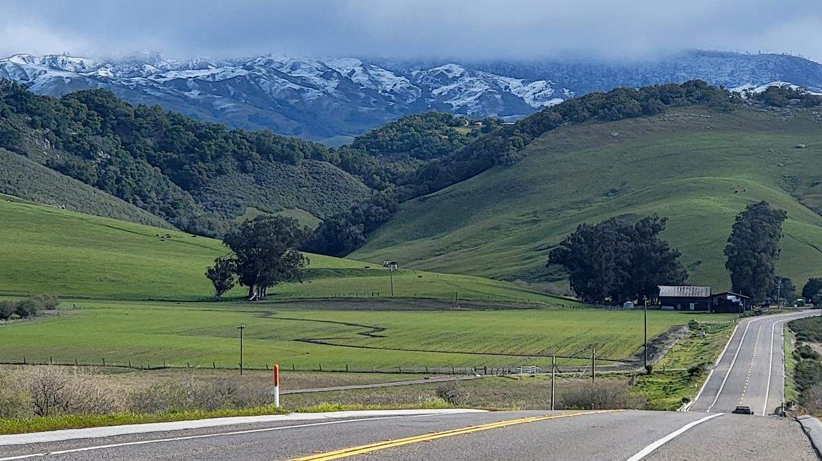 Snow dusts the hills north of Highway 46 West on Thursday morning, Feb. 23, 2023.