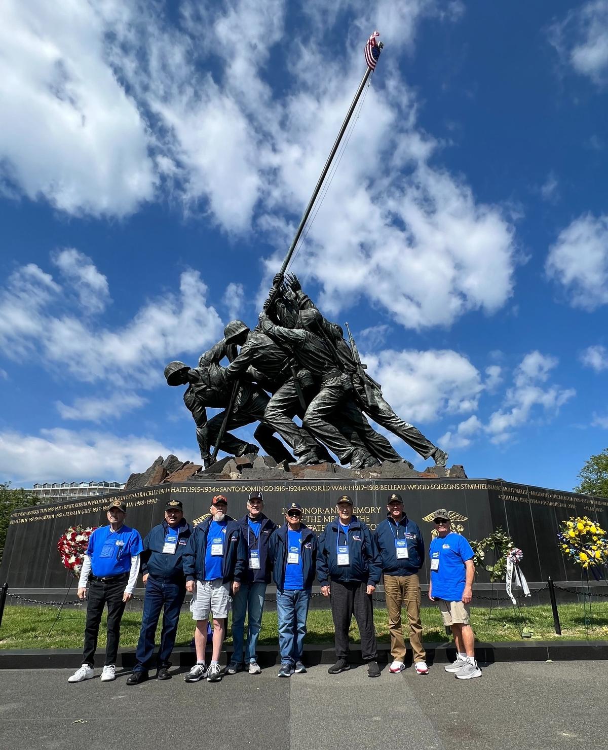 Honor Flight participants from the Central Coast pose in front of the Iwo Jima statue and the Marine Corps War Memorial in Washington, D.C., on Tuesday, April 25, 2023.