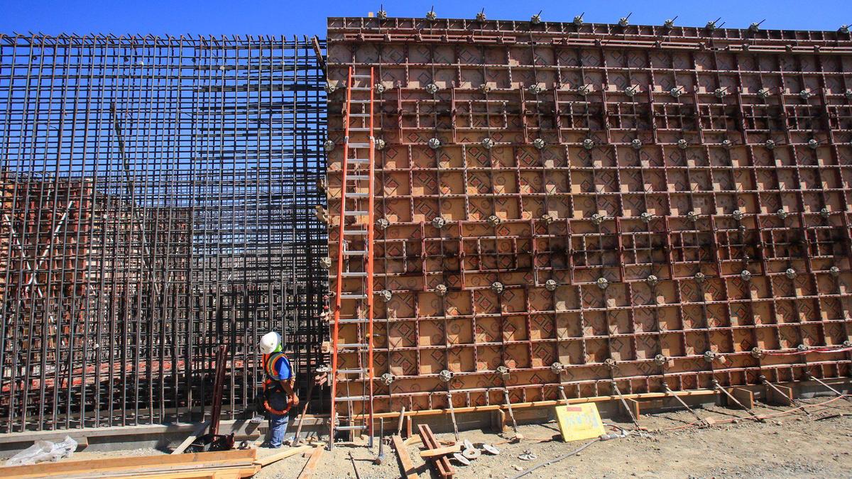 Eutimio Anguiano prepares to work on concrete forms at a tank at Morro Bay’s new Water Reclamation Facility. City officials gave a tour of the construction site on Monday.