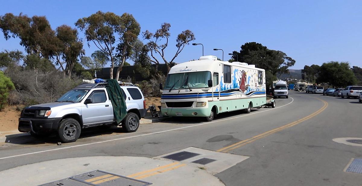 Dozens of unhoused people live in a collection of RVs, vans and other vehicles that line Palisades Avenue in Los Osos. Those who live on the street say they’ve built a community, but neighbors feel uncomfortable accessing a nearby park, community center and library.