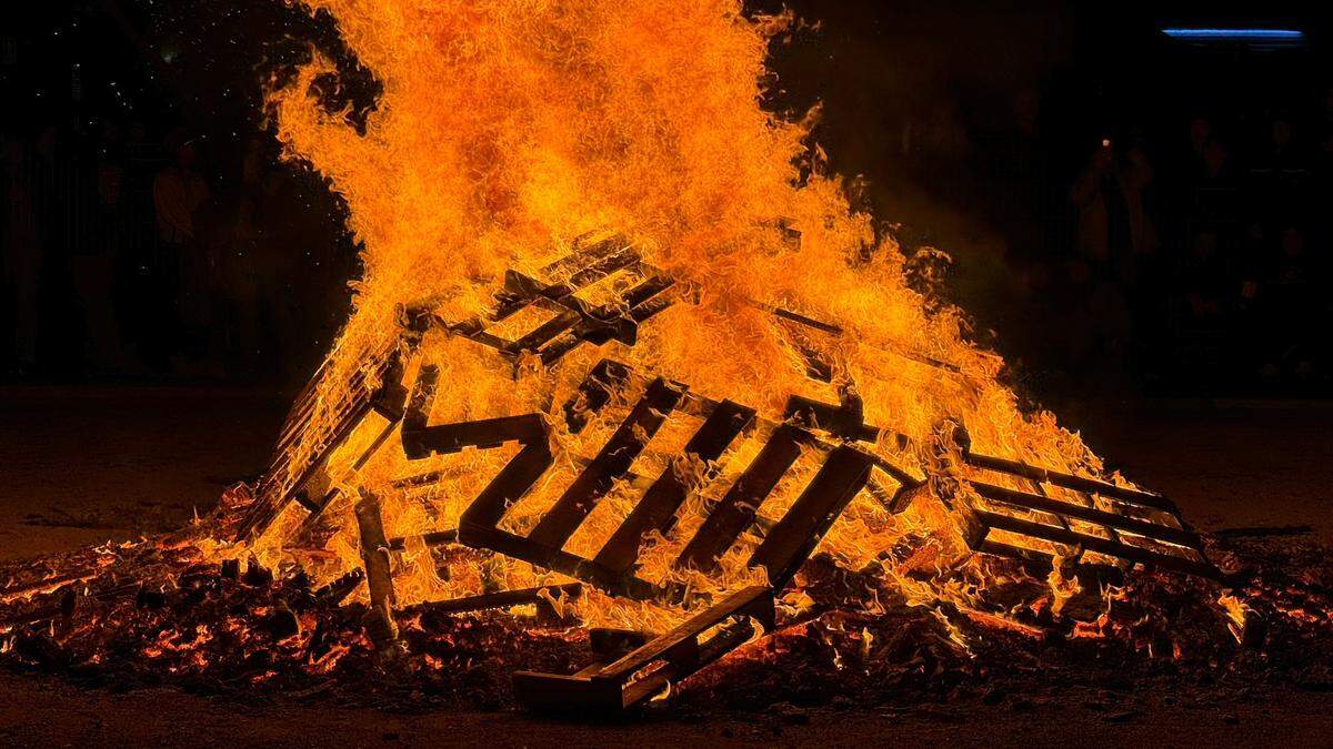 The giant bonfire throws flames into the air at Paso Robles’ New Year’s Eve celebration in the Downtown City Park on Dec. 31, 2023.