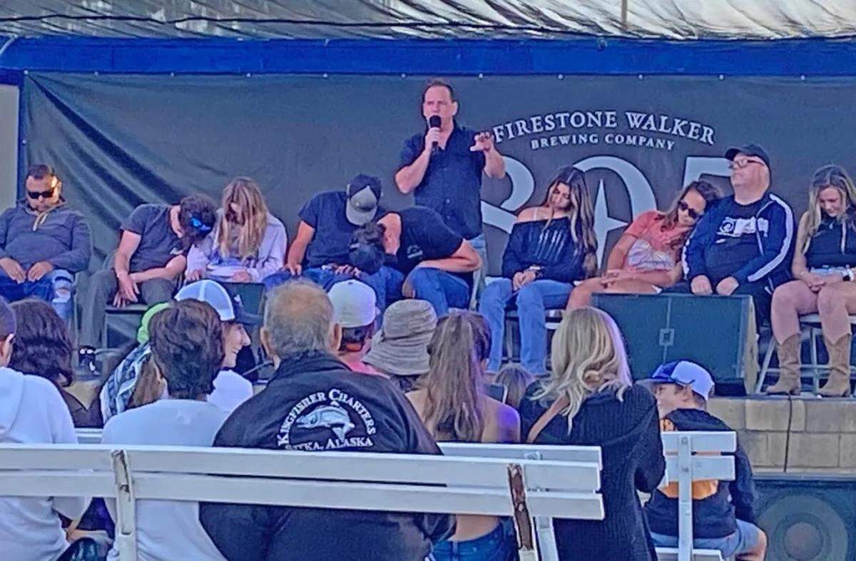 With hypnotized volunteers behind him, Tyzen talks to audience at the Santa Barbara County Fair on Wednesday evening. The fair at the Santa Maria Fairpark runs through Sunday.