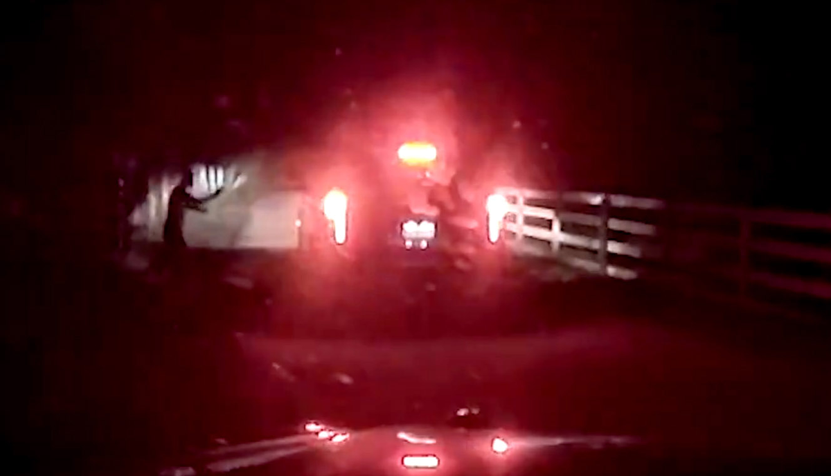 A screenshot from dash cam footage shows 37-year-old Templeton resident Thomas Farrell pointing his gun at a San Luis Obispo County Sheriff’s Office patrol vehicle on Jan. 29, 2025. Farrell was shot twice by officers after he shot at the patrol vehicle, the agency said. The agency released the footage of the incident on March 25, 2025. Farrell has since been charged with two counts of attempted murder of a peace officer.