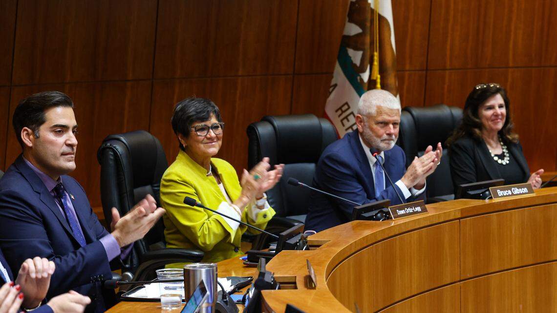 San Luis Obispo County Supervisors applaud the swearing-in of officials on Jan. 3, 2023. From left are Jimmy Paulding, Dawn Ortiz-Legg, Bruce Gibson and Debbie Arnold. John Peschong was absent.