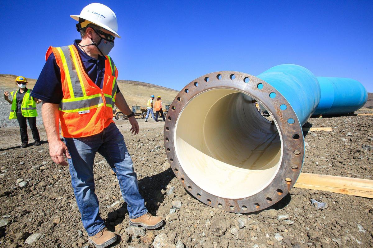 Paul Amico, pipeline project manager, looks over the pipe that will carry clean, chlorinated water away from Morro Bay’s new Water Reclamation Facility. City officials gave a tour of the construction site on Monday.