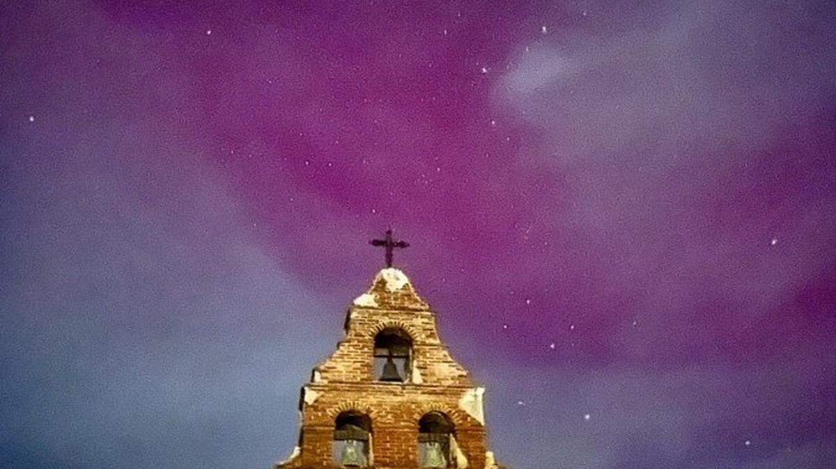 The northern lights returned to San Luis Obispo County on Thursday, Oct. 10, 2024, turning the night skies pink and purple over Mission San Miguel.