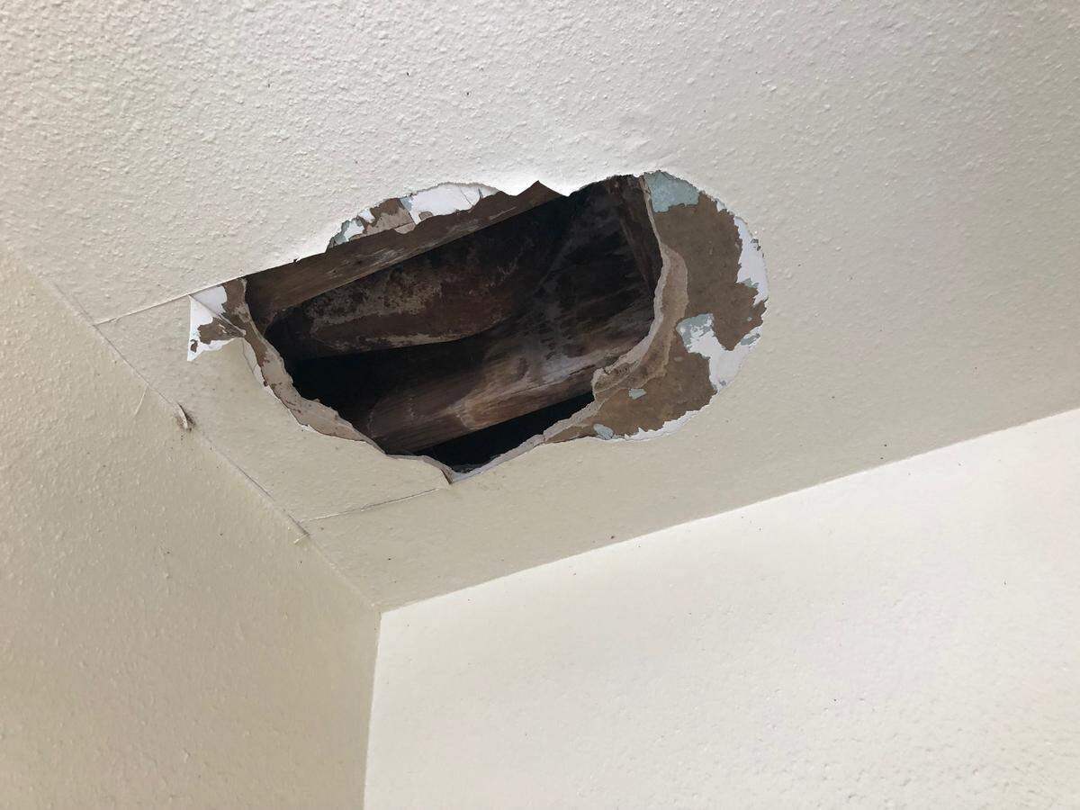 A hole in the ceiling of a Grand View tenant’s unit.