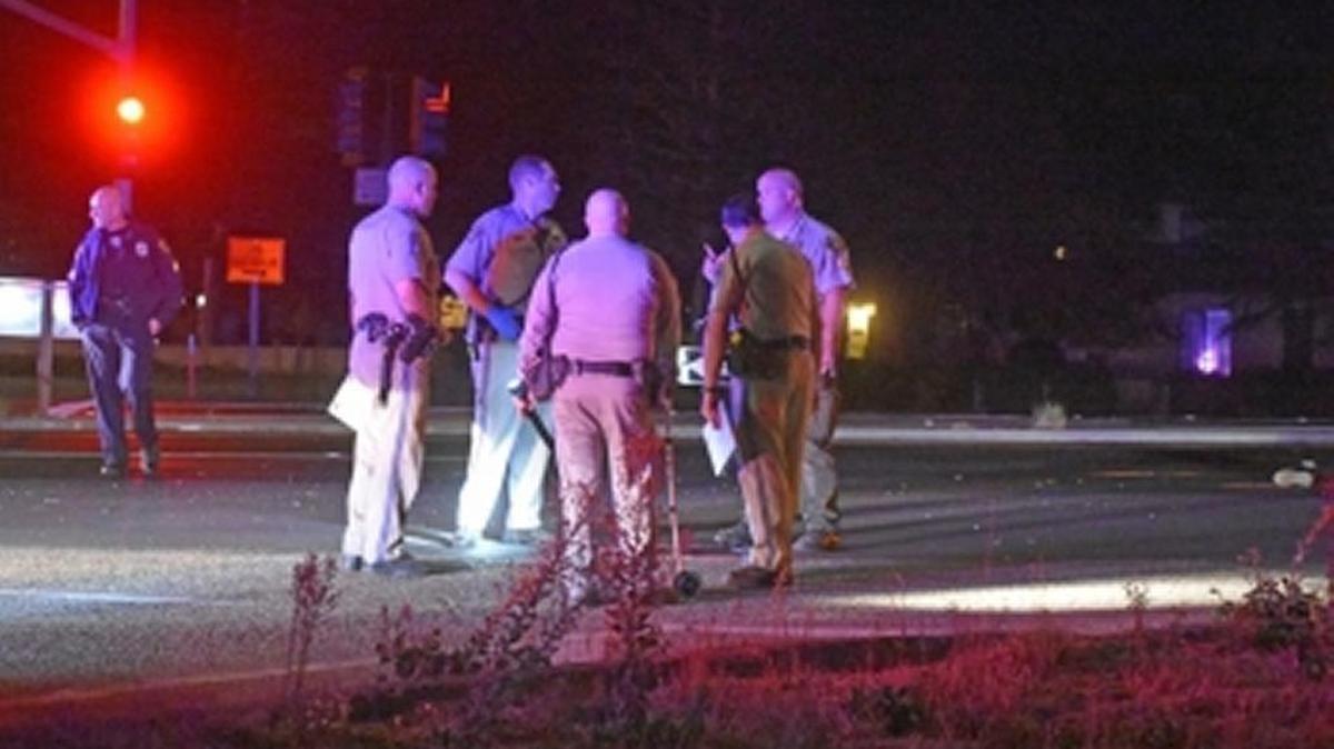 Investigators compare notes Sunday night after a woman was struck and killed by a hit-and-run driver on Highway 135 near Goodwin Road in Orcutt.