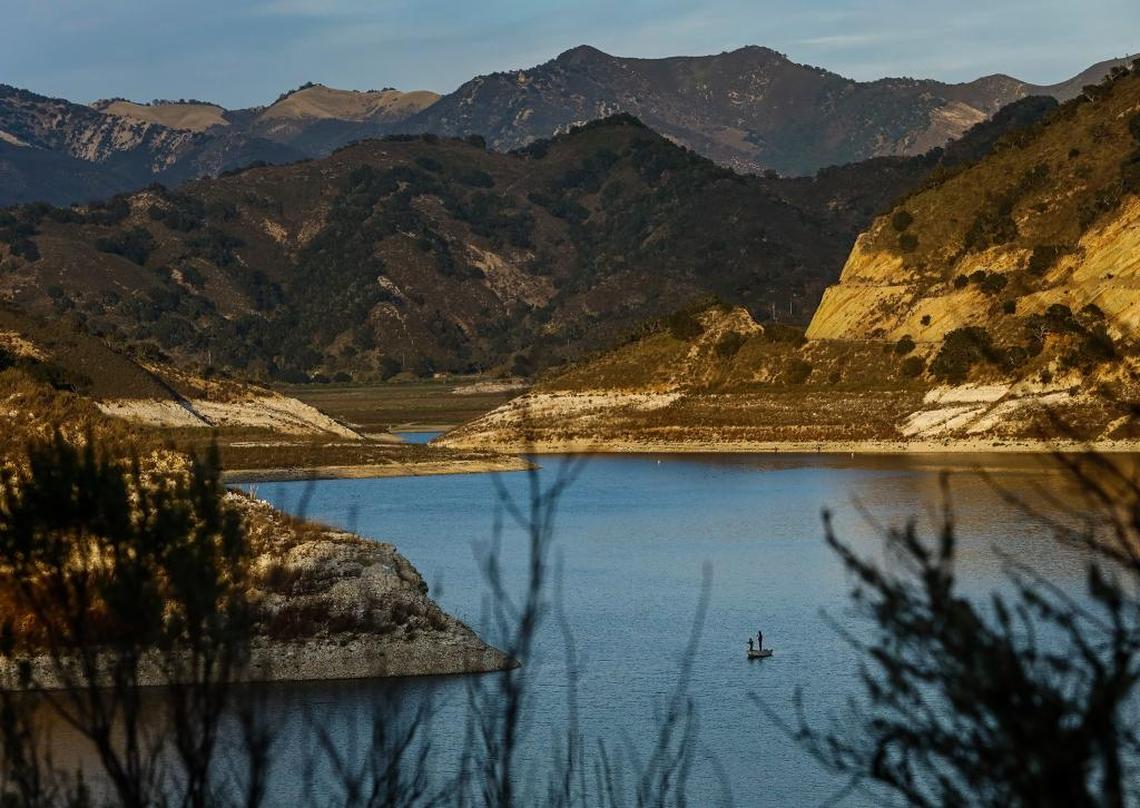 A pair of fisherman cast their lines into the waters of Lopez Lake.
