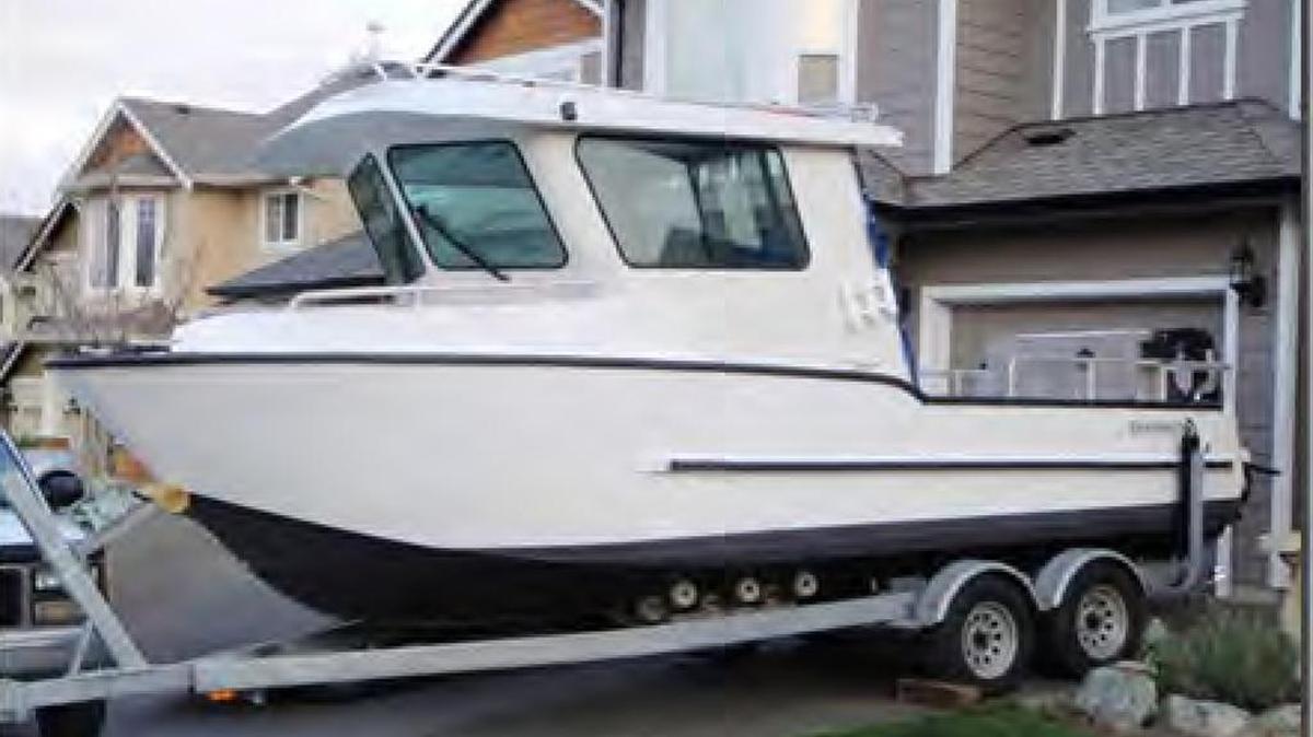 A boat parked in a Morro Bay driveway.