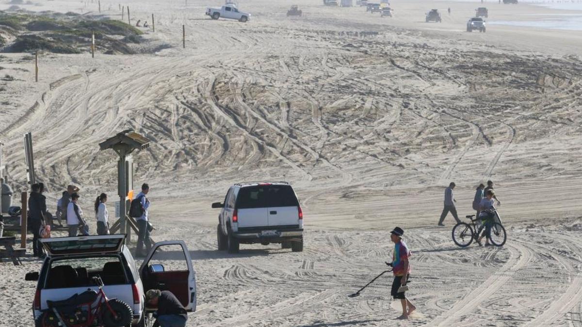 Warm weather in December 2016 brought beachgoers to the dunes in Oceano near the Pier Ave. ramp.