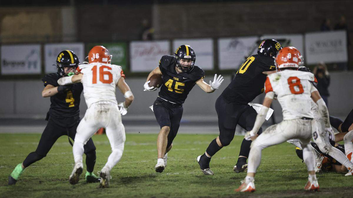 Colbin Garrison finds a hole in the line to run. San Luis Obispo beat Atascadero 35-0 to win a league title on Nov. 1, 2024.
