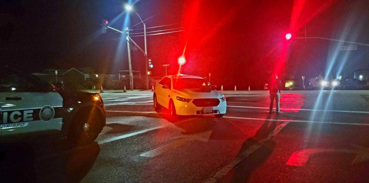 San Luis Obispo police investigate the scene of a deadly crash that killed a cyclist on South Higuera Street on Saturday night, Feb. 11, 2023.