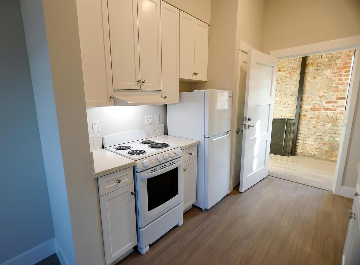 The new Bishop Street Studios is an apartment complex for low-income and mentally ill people in the old Sunny Acres Orphanage location. Each unit includes its own kitchen.