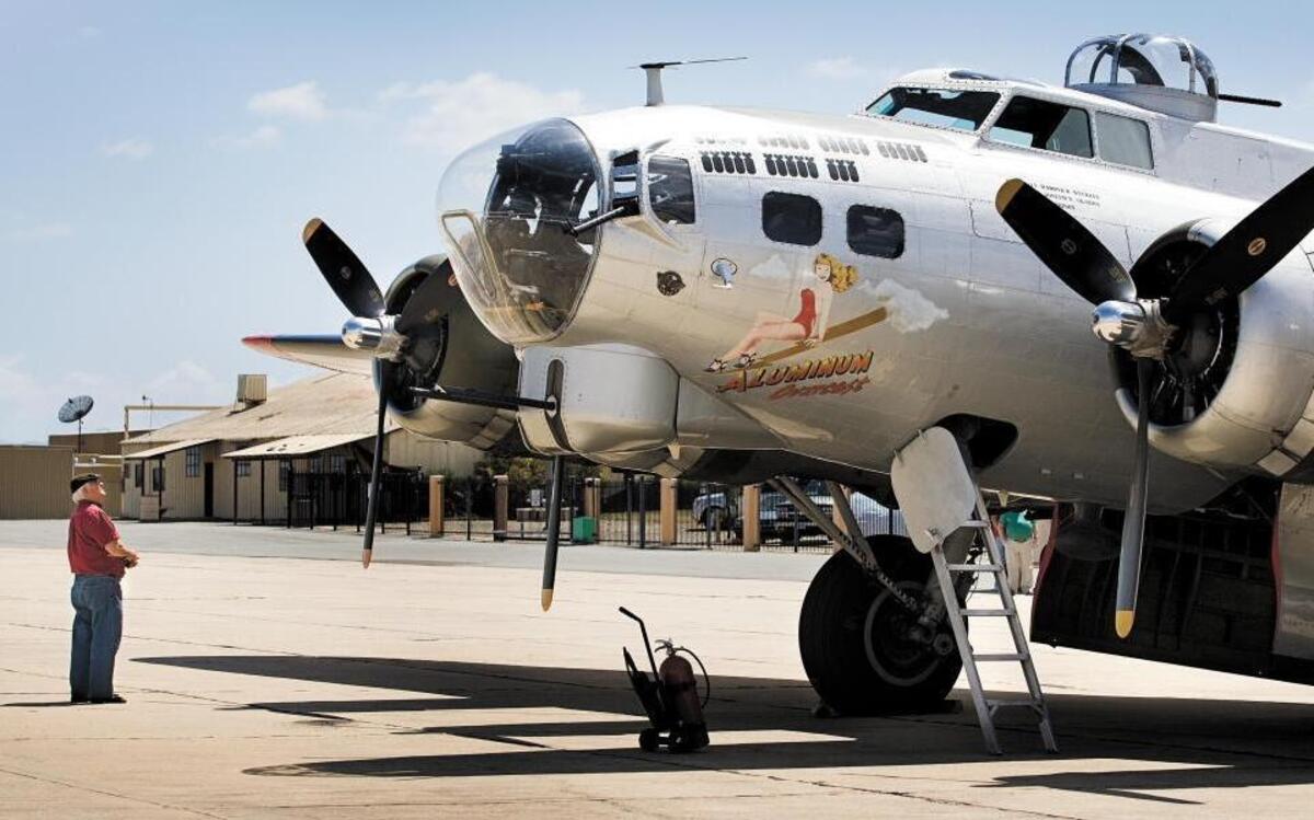 Elliot Dreger of Arroyo Grande looks over the B-17 Aluminum Overcast on display at Paso Robles Municipal Airport in 2013. The airport is the site of the inaugural Paso Robles AirFest on Friday and Saturday.