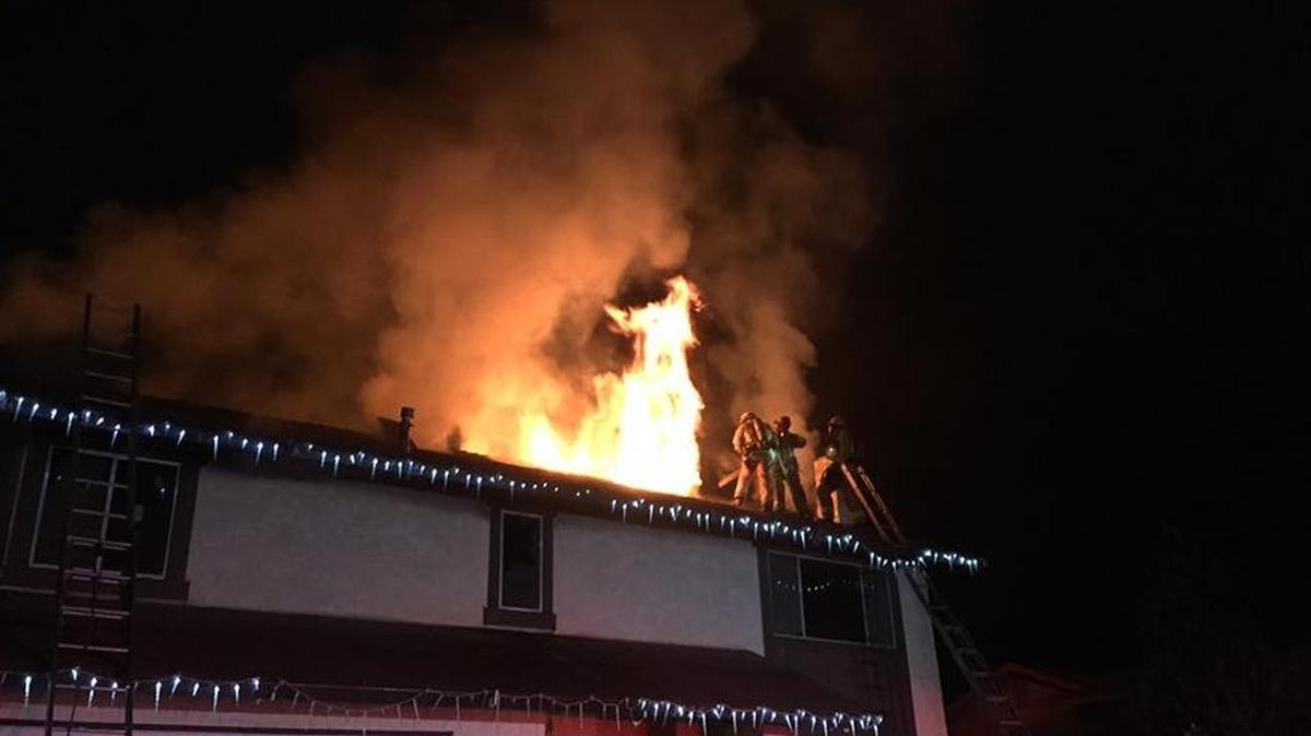 Santa Maria firefighters battle a house fire on the 1300 block of Smoke Tree Lane on Sunday, Dec. 25, 2016.