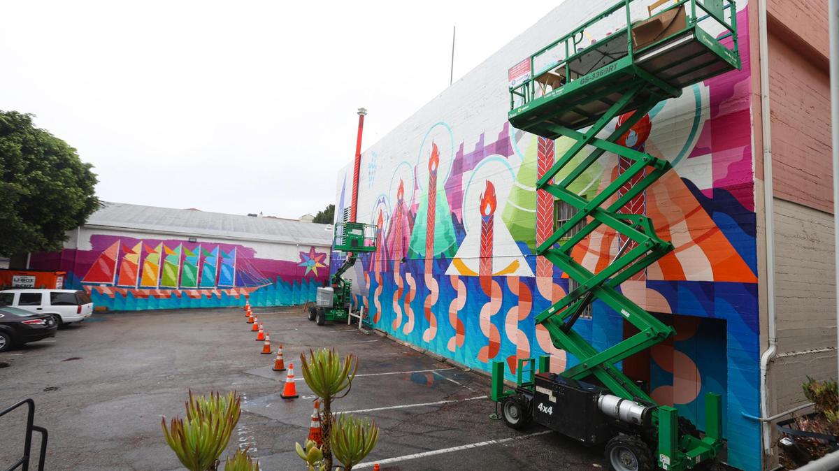 A wrap-around mural on the back of the Fremont Theatre and Woodstock’s Pizza is the work of Boston-based artist Maria Molteni. It connects the Seven Sisters with the seven Pleiades. “If you’re looking at the picture, you can see there are the seven peaks that are being painted and then the ship on the Woodstock’s wall has seven sails, and that’s in reference to how the Pleaides star cluster was used for navigation on the ocean,” said Emma Saperstein, chief curator at the San Luis Obispo Museum of Art.