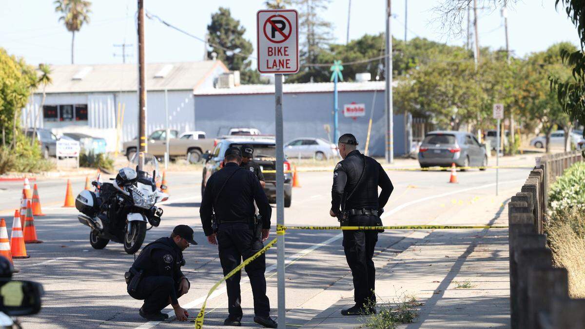 San Luis Obispo police investigate the scene of a hit-and-run that injured two bicyclists on South Higuera Street near the cemetery on Tuesday, July 23, 2024.
