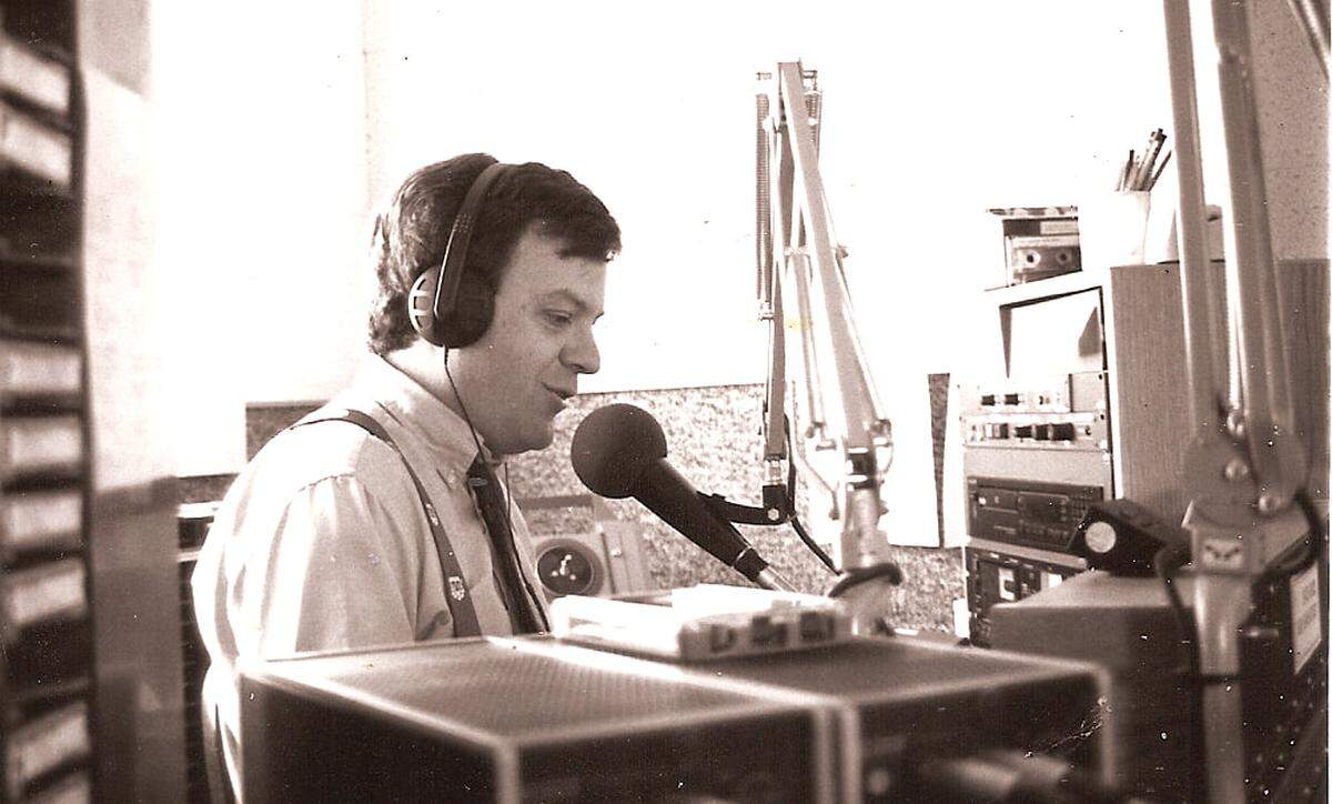Dave Congalton hosts “Hometown Radio” in a studio photo from early in his career.