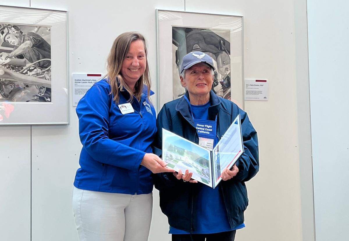 Air Force veteran Mo Masson, right, poses for a photo with an employee at the Women’s Military Museum in Washington, D.C., during the Honor Flight tour on Apri. 25, 2023.