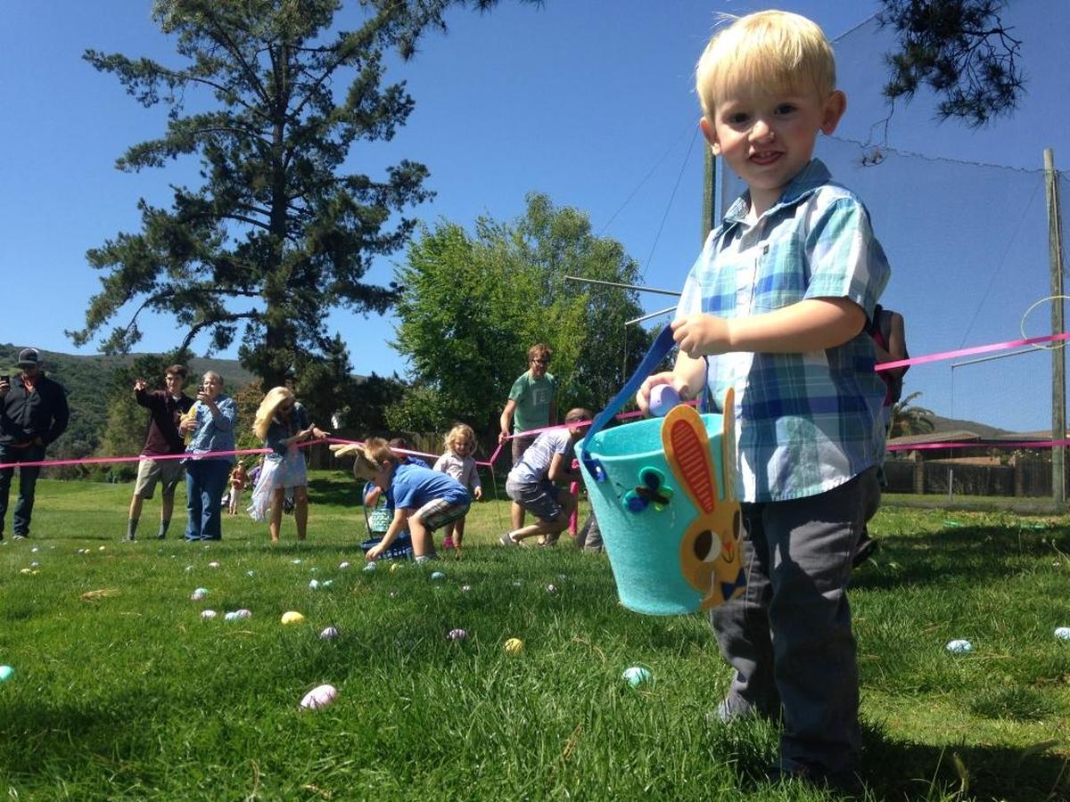 Jasper Gamble, 2, pauses briefly in his hunt for plastic Easter eggs in San Luis Obispo in 2017. Egg hunts are scheduled across San Luis Obispo County in March 2024.