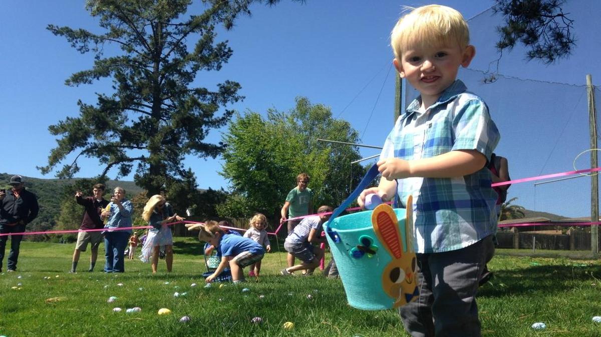 Jasper Gamble, 2, pauses briefly in his hunt for plastic Easter eggs in San Luis Obispo in 2017.