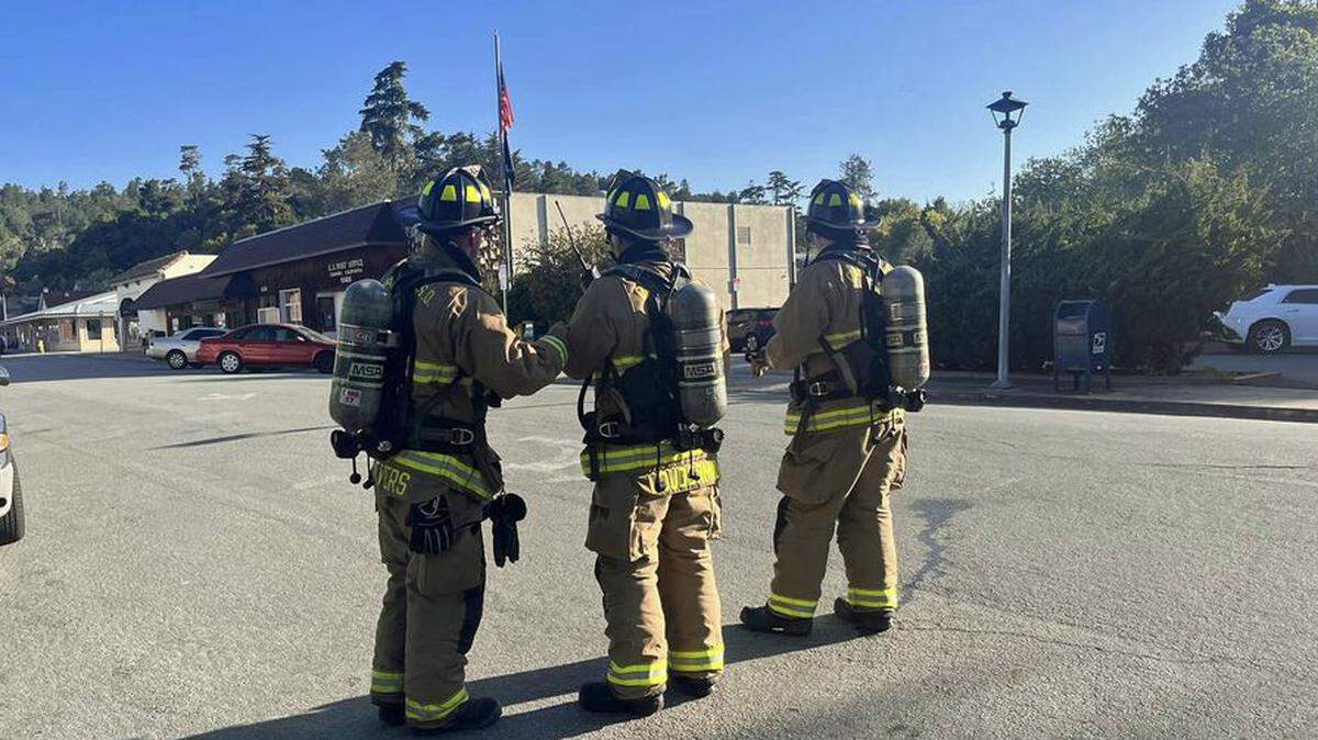 Firefighters man an evacuation line around a gas leak near the Post Office in downtown Cambria on Wednesday, April 19, 2023.