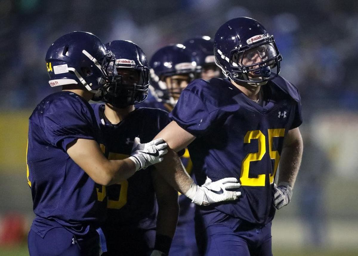 Arroyo Grande senior John Farley (right) was getting into scuffles with Lompoc players all night.
