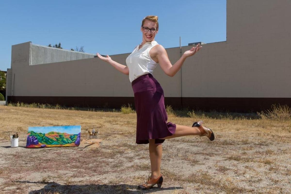 Atascadero artist Heather Millenaar poses in front of the old Founder’s Community Bank building on El Camino Real, where she’ll be painting a mural depicting the history of the city.